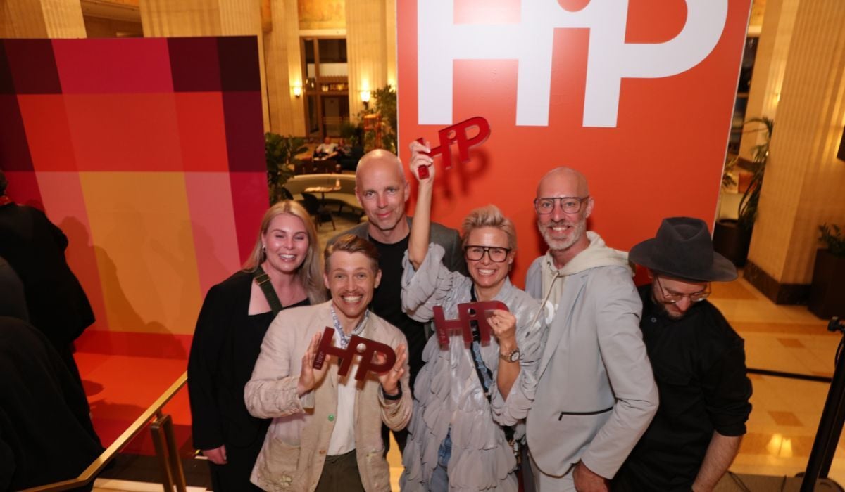 Group holding HiP award trophies at NeoCon